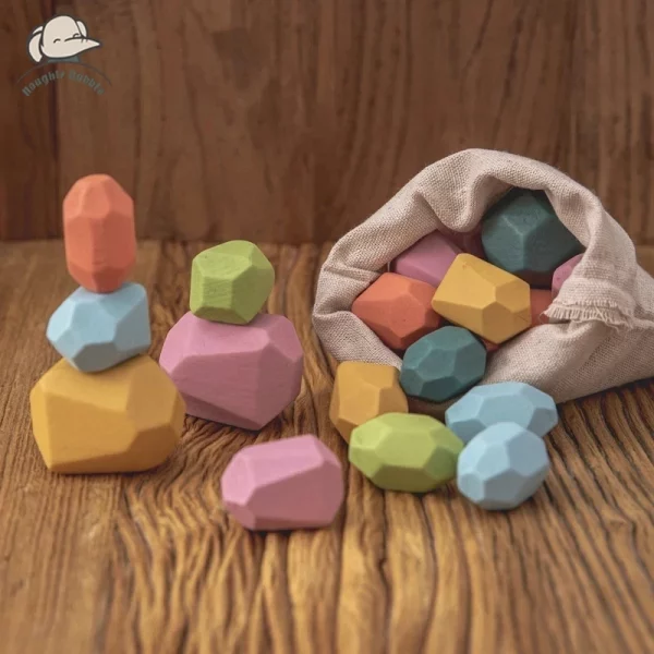 Pierres arc-en-ciel en bois Montessori, jeu d’équilibre et d’empilage. Stimule la motricité, la concentration et la créativité des enfants dès 4 ans.